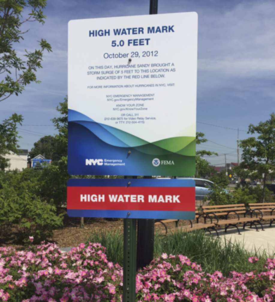 Street sign indicating the high water mark for Hurricane Sandy