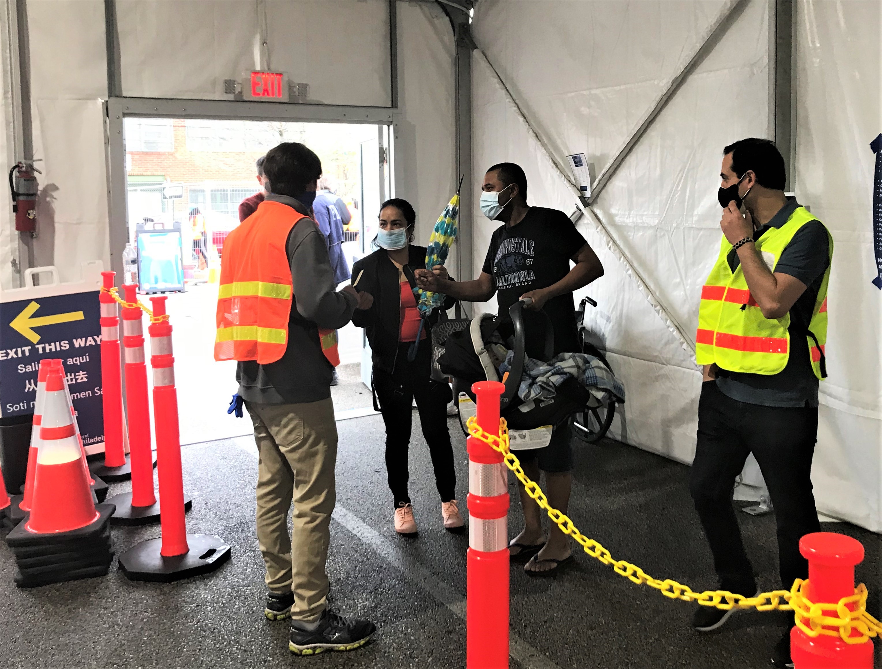 Staff assist incoming patients at the Esperanza Community Vaccination Center in North Philadelphia.