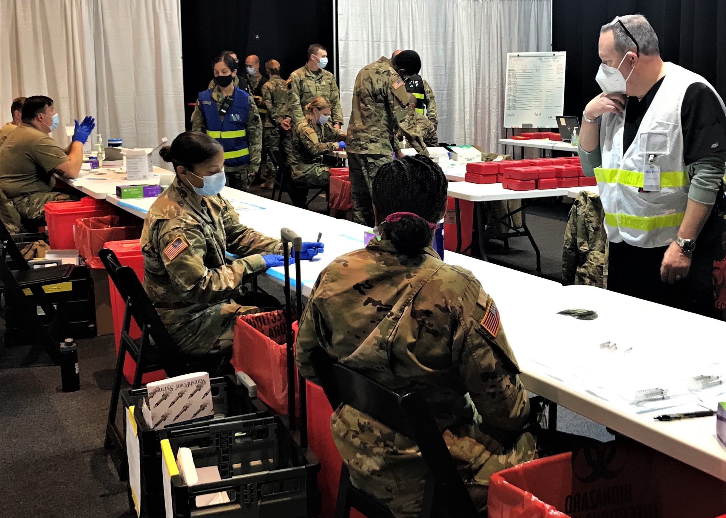 The Pennsylvania National Guard assists with patient registration and vaccine administration at the Esperanza Community Vaccination Center in North Philadelphia.