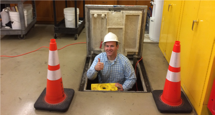 Man wearing a helmet and giving a thumbs up