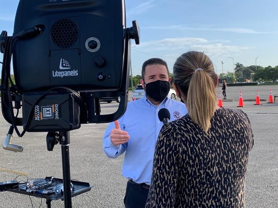 Spanish Spokesperson Daniel Llargues talks to reporter on the opening of a COVID Vaccination Center