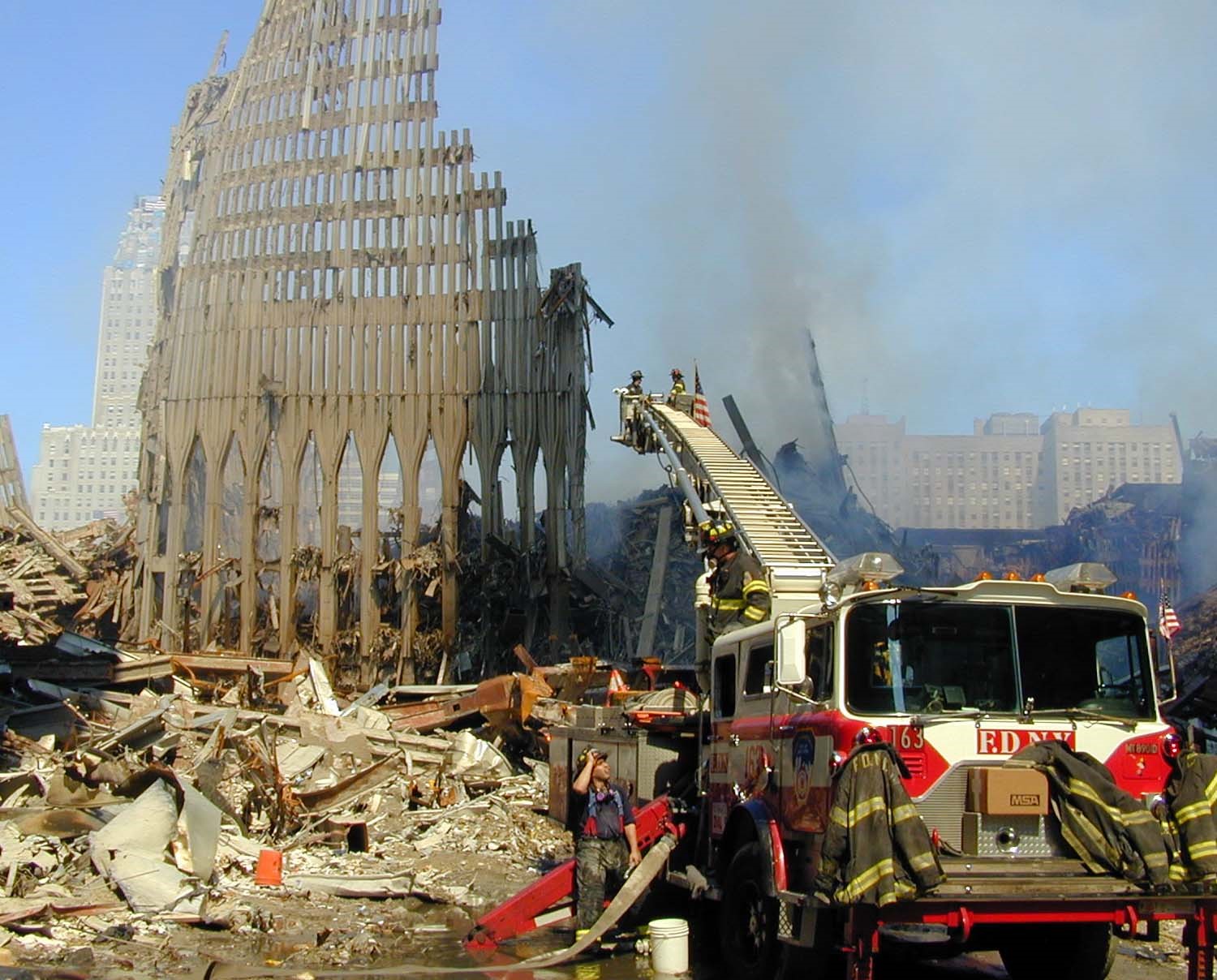 Firetruck in front of colliseum debris