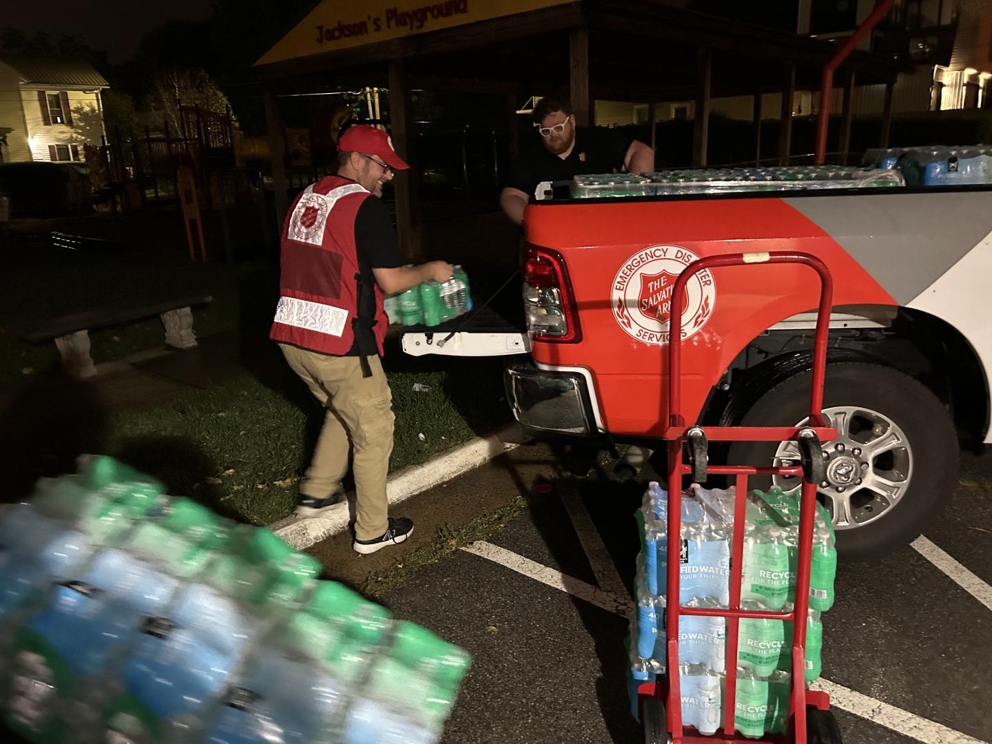 SEVIERVILLE, Tennessee -- The Salvation Army of Kentucky and Tennessee unload supplies from their truck for their mobile kitchen unit to serve meals to flood survivors and volunteers. (Photo Credit: The Salvation Army of Kentucky and Tennessee)