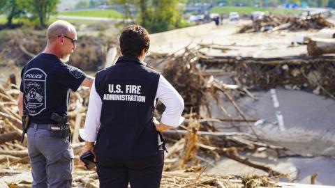 Caption: Erwin, Tenn. - (Oct. 3, 2024) - Town of Erwin Police Chief Regan Tilson and U.S. Fire Administrator Dr. Lori Moore-Merrell observing the I-26 bridges that were damaged during Hurricane Helene in Unicoi County, Tennessee.