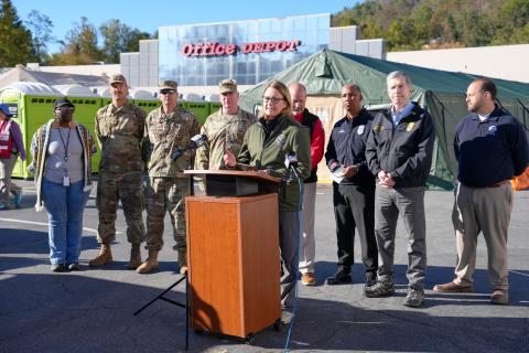 Caption: Asheville, NC (October 21, 2024) - FEMA Administrator, Deanne Criswell, and North Carolina Governor, Roy Cooper, visit a Community Care Station where they engage with volunteers and DoD responding to Hurricane Helene.