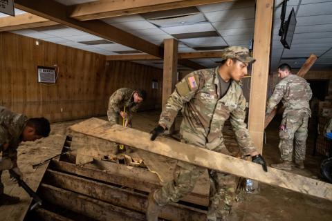 Caption: Chimney Rock, N.C. (Oct. 18, 2024) - U.S. Army Soldiers of the 325th Airborne Infantry Regiment remove debris from the riverside of Chimney Rock, N.C. on Friday, October 18, 2024. FEMA photo by Madeleine Cook