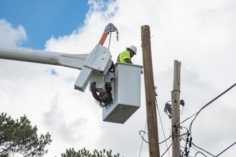 Caption: Augusta, Ga. - (Oct. 3, 2024) - A utility worker repairs telephone lines in the Richmond-Augusta community in Augusta, GA, After Hurricane Helene swept thru the area. Patsy Lynch/FEMA